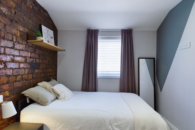 A Stylish And Inviting Double Bedroom Featuring A ...