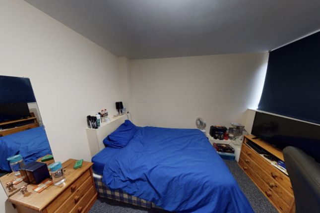 A Well-Kept Bedroom Featuring A Double Bed With Ma...