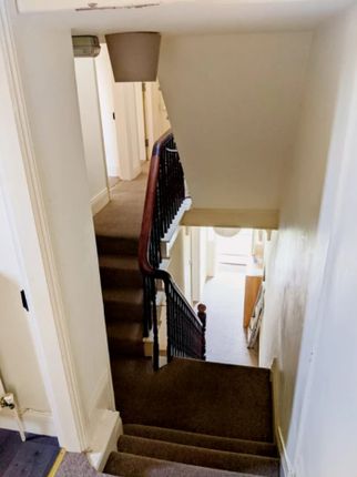 A Clean And Well-Maintained Staircase Leading To U...