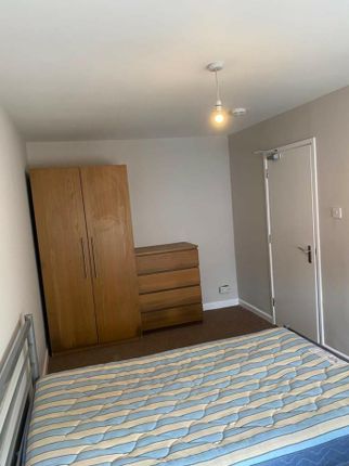 A Cozy Double Bedroom Featuring A Spacious Layout,...