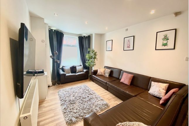 Contemporary Living Room With L-Shaped Leather Sof...