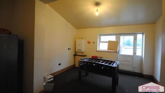 A Spacious And Bright Living Room With Large Windo...