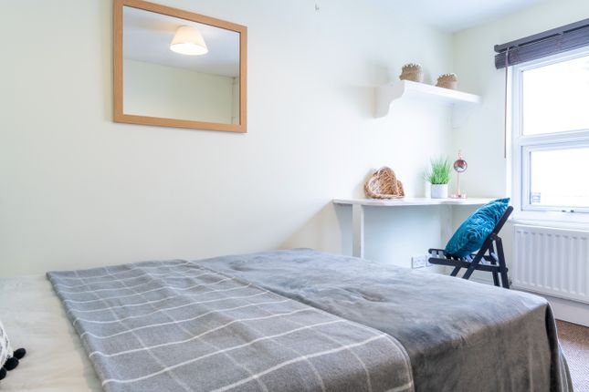 Bright And Inviting Double Bedroom Featuring A Com...