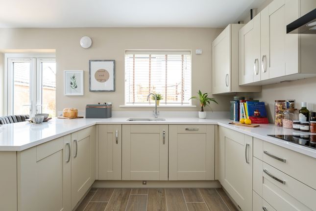 A Light And Airy Kitchen, With Views Of The Garden