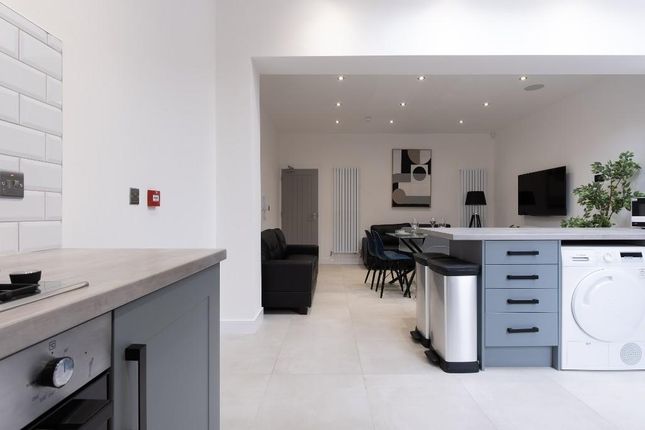 A Bright And Spacious Modern Living Area With A cl...