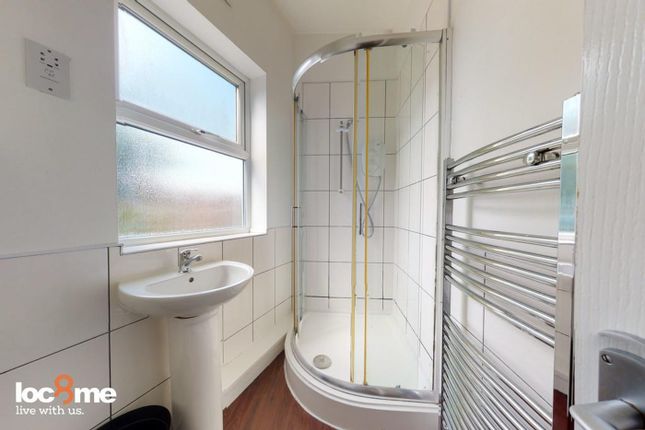 A Bright And Modern Bathroom Featuring A Spacious ...