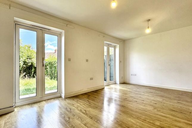 Bright And Airy Living Room Featuring Large Glass ...