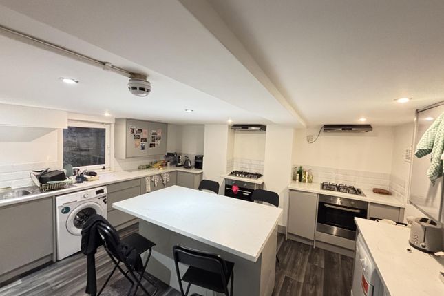 A Bright, Modern Kitchen With Ample Workspace And ...
