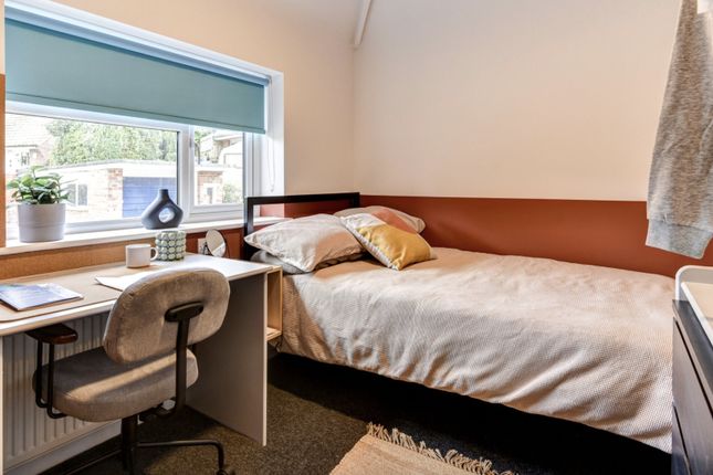 This Inviting Double Bedroom Features A Cozy Layou...