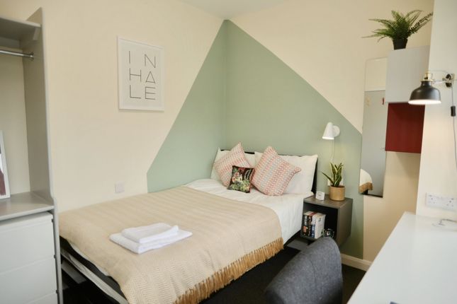 This Inviting Double Bedroom Features Stylish Deco...