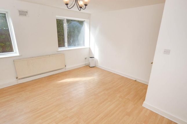 A Spacious And Bright Living Room With Large Windo...