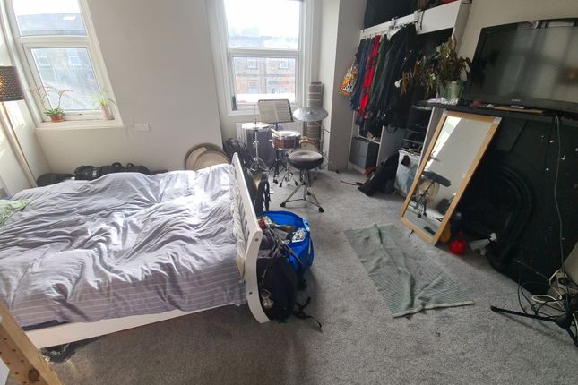 A Cozy Double Bedroom Featuring A Comfortable Bed,...