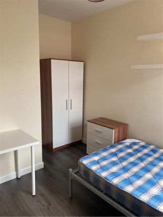 A Clean And Bright Double Bedroom Featuring A Simp...