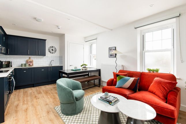 Bright And Stylish Living Room Featuring A Vibrant...
