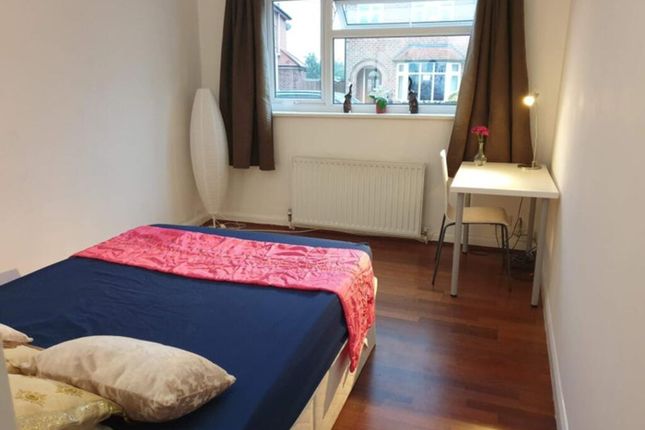 A Bright And Cozy Double Bedroom Featuring A Comfo...