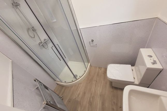 This Modern Bathroom Features A Spacious Shower, S...
