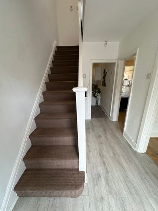 A Well-Maintained Staircase Leading To Upper Level...