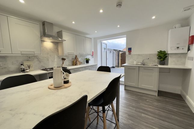 A Modern And Spacious Kitchen With Ample Natural l...