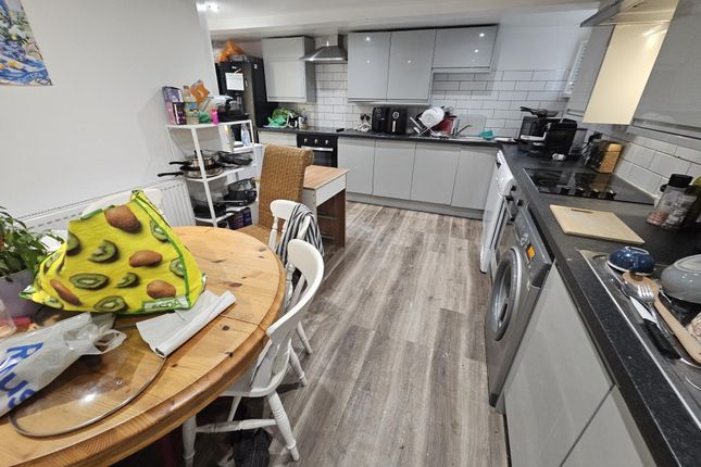 Modern Kitchen With Ample White Cabinetry, Stainle...