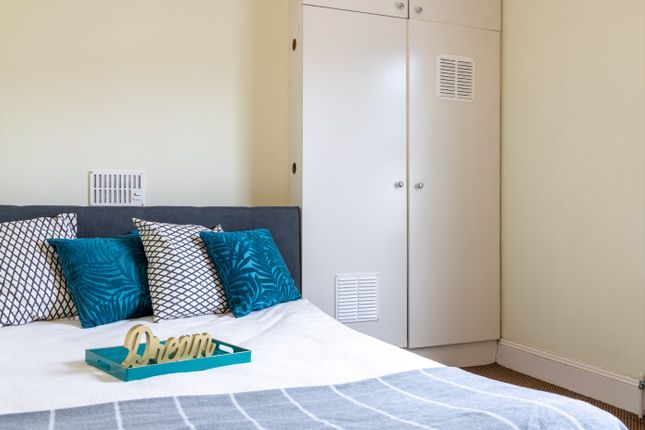 This Cozy Double Bedroom Features A Stylish Design...