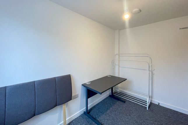 This Inviting Double Bedroom Features A Comfortabl...