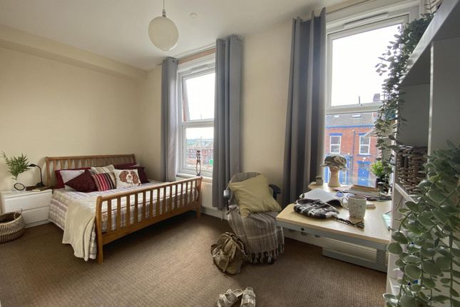 Bright, Neatly Styled Double Bedroom With A Wooden...