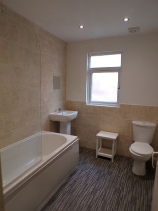 A Spacious And Modern Bathroom Featuring A Relaxin...