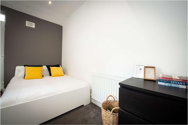 A Bright And Clean Double Bedroom Featuring A Comf...