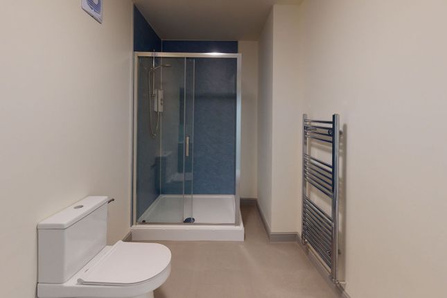 Modern Bathroom Featuring A Sleek Toilet, A Spacio...