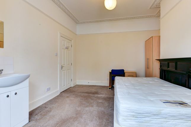 A Spacious Master Bedroom With A Large Bed And Amp...