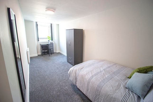 Spacious Double Bedroom Featuring A Cozy Bed, Ampl...