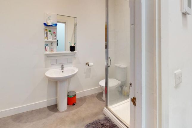 This Modern Bathroom Features A Spacious Shower Ar...