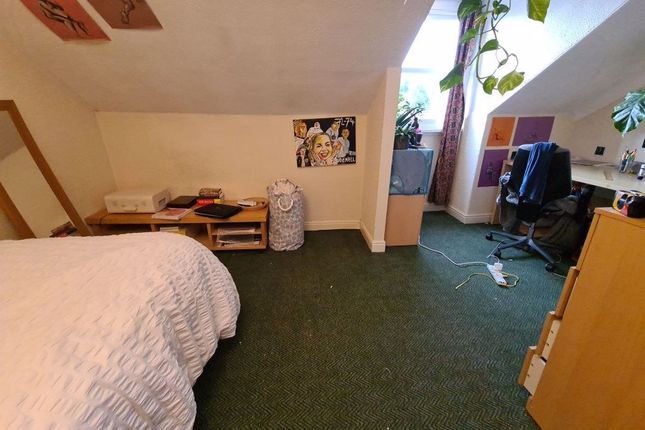 A Cozy And Inviting Living Room Featuring A Comfor...