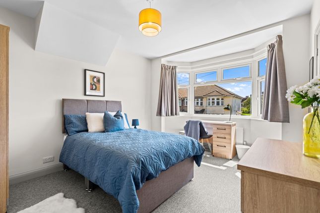 Bright And Spacious Master Bedroom Featuring A Com...
