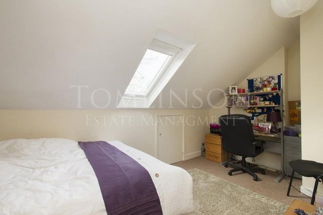 A Cozy And Well-Kept Master Bedroom Featuring A Co...