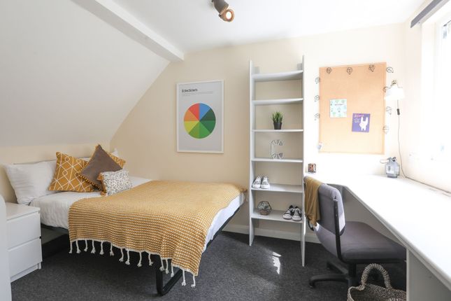 This Charming Double Bedroom Features A Cozy Layou...
