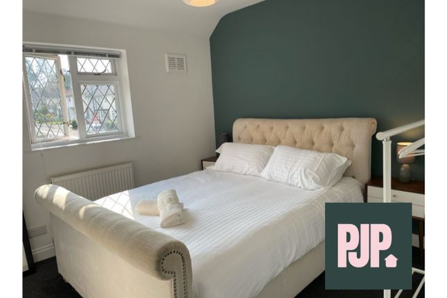 A Stylish And Inviting Double Bedroom With Ample N...