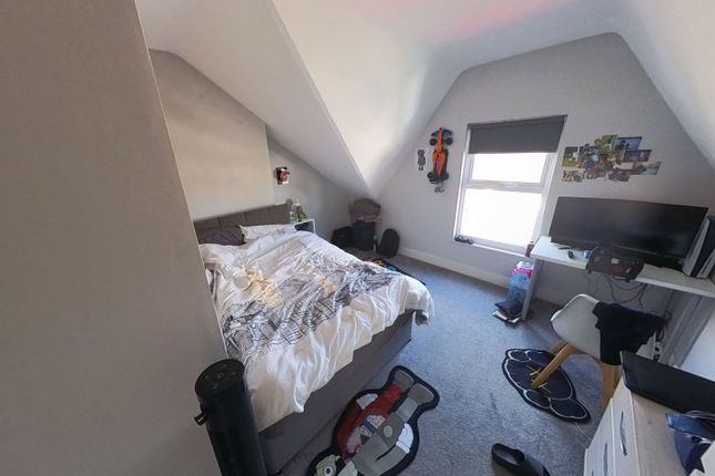 A Cozy Bedroom With A Comfortable Double Bed, A De...