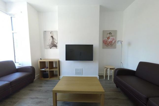 Bright, Contemporary Living Room With Matching Sof...