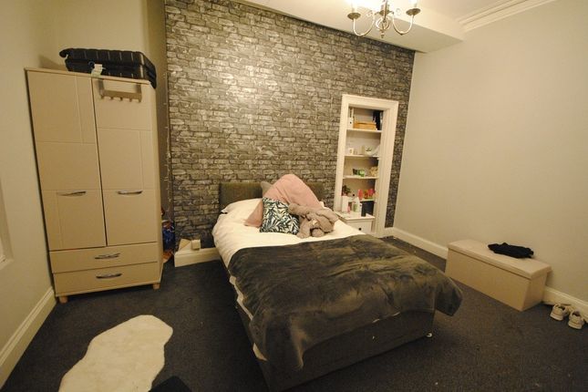 A Spacious And Inviting Master Bedroom Featuring A...