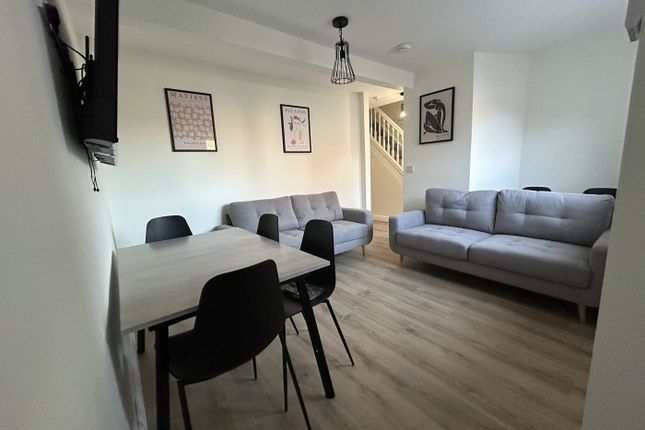 A Spacious And Inviting Modern Living Room Perfect...