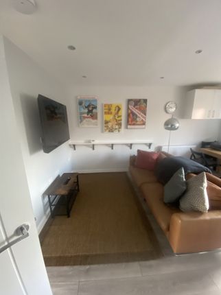 A Stylish And Inviting Living Room With Modern Dec...