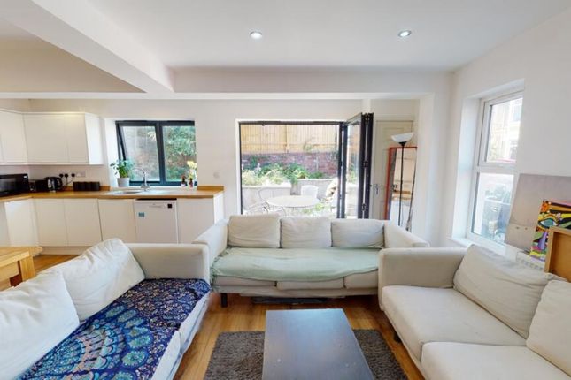 Bright And Inviting Living Room Featuring A Spacio...