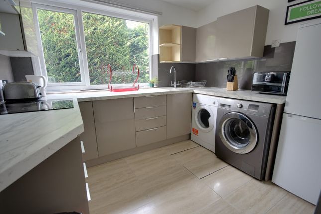 A Modern And Tidy Kitchenette With Ample Natural l...