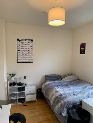 A Cozy Double Bedroom Featuring A Comfortable Bed ...