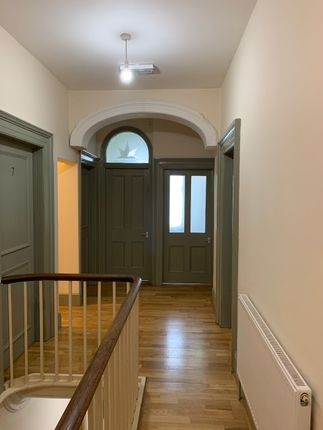 Bright And Clean Hallway With Polished Wooden Floo...