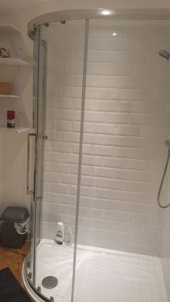 A Modern And Clean Bathroom Featuring A Stylish Sh...