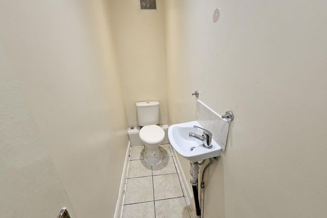 A Clean And Functional Bathroom Featuring A Toilet...