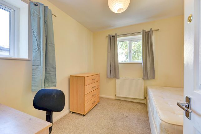 A Cozy And Well-Lit Single Bedroom Featuring A Sim...