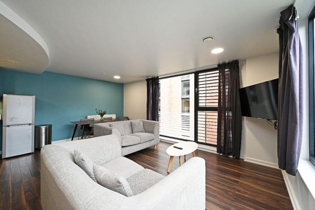 Bright And Modern Living Room Featuring Large Wind...